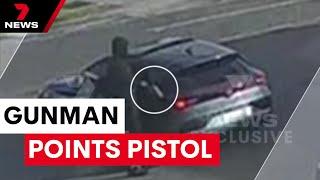 Masked gunman points pistol at car  7NEWS
