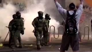 WARNING GRAPHIC CONTENT - U.S. riot police use tear gas hit Portland protester with batons