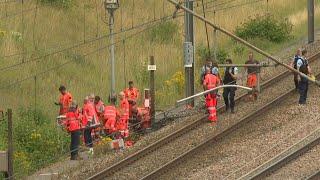 Police railway employees work along train tracks in northern France  AFP