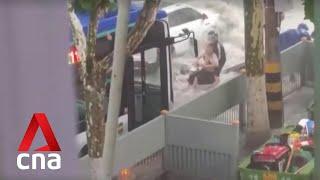 Typhoon Doksuri Bus driver in China saves man from floodwaters