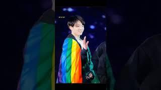 Idols holding rainbow flag 