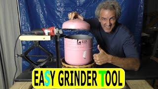 Using an angle grinder to cut a Freon tank for my foundry