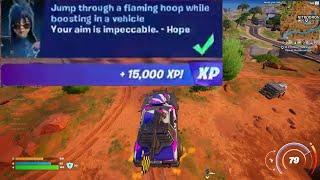 Jump through a flaming hoop while boosting in a vehicle Fortnite