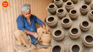 The Craftsman Making is Primitive style Pottery with Great Skills  The top works