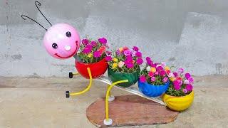 Decorate garden with funny deep-shaped plant pots from recycled plastic balls