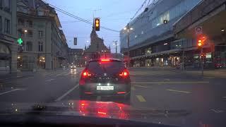 Driving in rainy weather at dusk through Bern Switzerland 