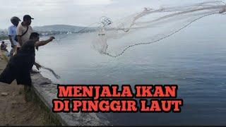 MENJALA IKAN DI PINGGIRAN LAUT