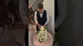 Bride did NOT expect this form the GROOM during cake cutting