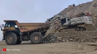 Huge Liebherr R 9150 Mining Excavator Loading Liebherr Haul Truck.