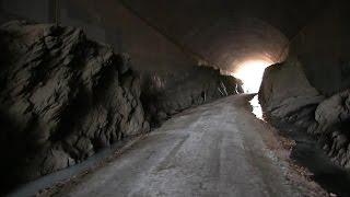 Tunnel with rock formations  and ice
