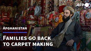 Afghan families go back to making carpets as economy unravels  AFP