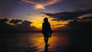 Woman walking alone on the Beach at Sunset  Free Stock Footage No Copyright
