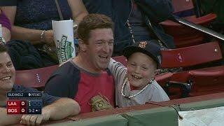 LAA@BOS Young fan shows his excitement over souvenir