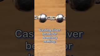 Sand casting silver beads.