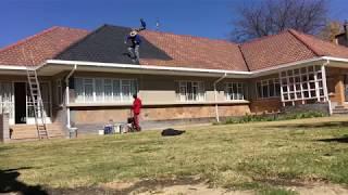 Airless spraying a tile roof time-lapse