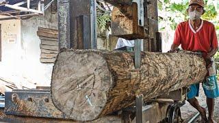 Sawing good dry teak wood full of beautiful grain