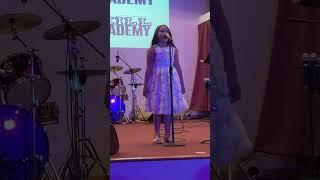 Miss Mila singing the song” Rise up”June 2023