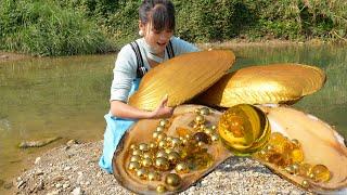 A golden water treasure the girl found a golden mutated giant clam and many pearls in the river