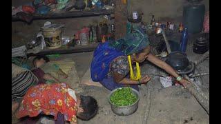 Cooking curry of food item green vegetables  Nepali village