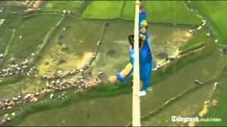 Acrobat falls off tight-rope in death defying high wire stunt gone wrong