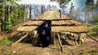 Building of a round bushcraft dugout for survival in the wild