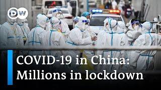 China Millions in lockdown after COVID cases rise  DW News