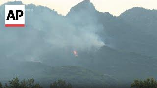 Pakistani authorities battle forest fires in Islamabads Margalla Hills National Park