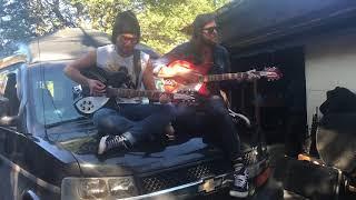 Adam Baldwin and Matt Mays play Learning To Fly on the hood of a van in a Toronto alley.