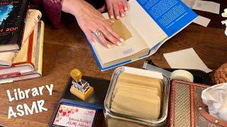 ASMRLibrary chores No talking Checking in books typing book envelopes dust jacket covering.