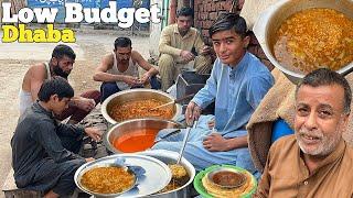 REAL HERO - YOUNG SCHOOL BOY HELPING HIS FATHER TO PREPARE BREAKFAST DHABA ON ROAD SIDE LAHORE