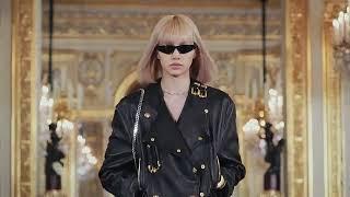 blackpink lisa walks on a runway for celine women winter 22