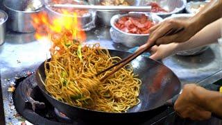Chinese Street Food -Fried noodles with egg fried rice fried broiler egg and vegetable pie