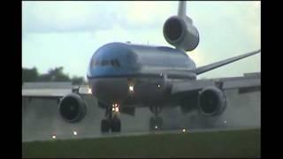 KLM MD-11 Jet cleans wet runway with reverse thrust at SMJP