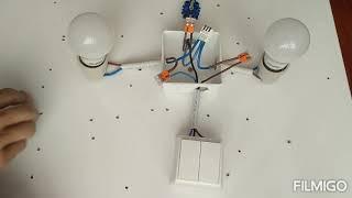 How to connect the commutator switch? electrical installation with two lamps and two switches