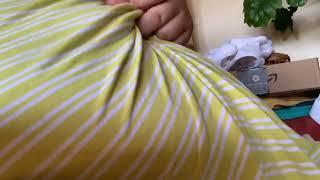 Gently teasing my navel through yellow striped dress