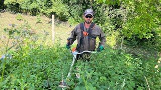 Stihl Fs 460-C with 33 mm trimer line cutting big grass on slope.