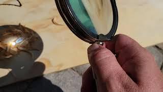 Starting a fire with a magnifying glass in under a minute