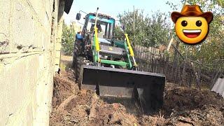 A young farmer from Ukraine hitched a loader to a tractor and went to Grandma to take out pork poop