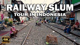 Walking a RAILWAY SLUM TOUR in INDONESIA 4K