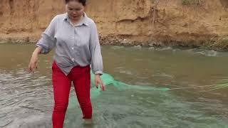 River fishing with traps made of blue net nets