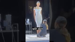 Liquid dress on a naked model at a fashion show in France