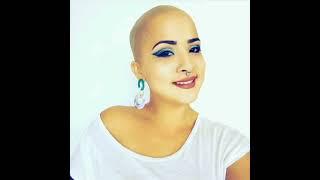 SEXY BALD GIRL shaves her head with razor and rubbing her bald head