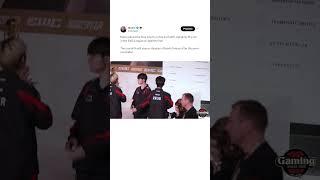 Faker placing the trophy on the monolith at the Esports World Cup