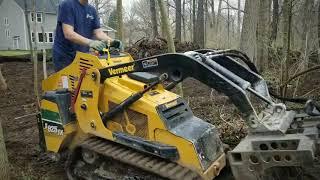 Clearing backyard woods of brush logs and debris for customers playground