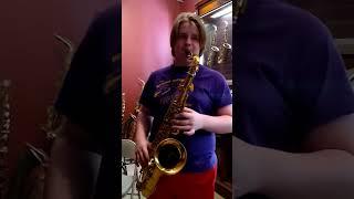 teenager playing a $15000 saxophone