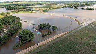 Midwest hit with severe flooding as heat wave persists across US