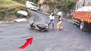 Scooter riders fells down. heavy lorry turning. Dhimbam ghat