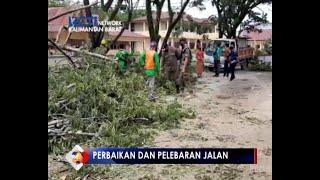 JALAN TSAFIOEDIN MULAI DIKERJAKAN DARI PEMANGKASAN POHON