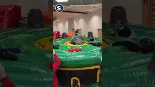 Colleagues Play Whack-A-Mole as Part of Team Building Exercise