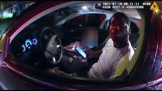 Body camera video shows police officer shoot and kill man while being dragged by car